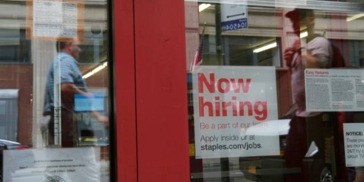 US hiring surged past expectations in December while unemployment dipped, according to government figures. ©AFP