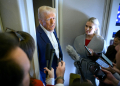 US President Donald Trump speaks with the press, alongside White House Press Secretary Karoline Leavitt (R), on board Air Force One  / ©AFP