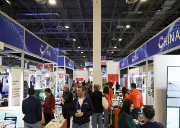 Attendees walk past a row of Chinese businesses at the annual Las Vegas tech show CES in January, 2024. ©AFP