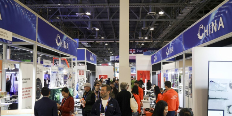 Attendees walk past a row of Chinese businesses at the annual Las Vegas tech show CES in January, 2024. ©AFP