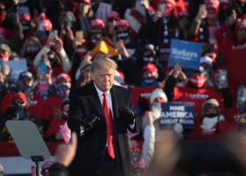 Donald Trump, shown here dancing to a Village People song as he wraps up a campaign rally at Green Bay-Austin Straubel International Airport on October 30, 2020 in Green Bay, Wisconsin / ©AFP