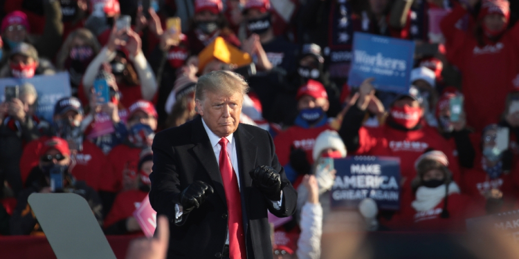 Donald Trump, shown here dancing to a Village People song as he wraps up a campaign rally at Green Bay-Austin Straubel International Airport on October 30, 2020 in Green Bay, Wisconsin / ©AFP