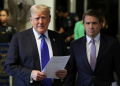 President Donald Trump, flanked by his lawyer Todd Blanche, speaks to reporters at his hush money trial in New York in May 2024 / ©AFP