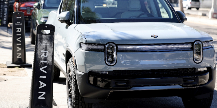 Shares of Rivian and other electric vehicle companies fell after US President Donald Trump issued an executive order targeting the EV industry  / ©AFP