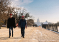 Trump supporters walk along the mostly empty National Mall before Donald Trump's inauguration on January 20, 2025 / ©AFP