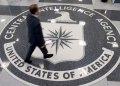 A man crosses the Central Intelligence Agency (CIA) seal in the lobby of CIA Headquarters in Langley, Virginia in August 2008 / ©AFP