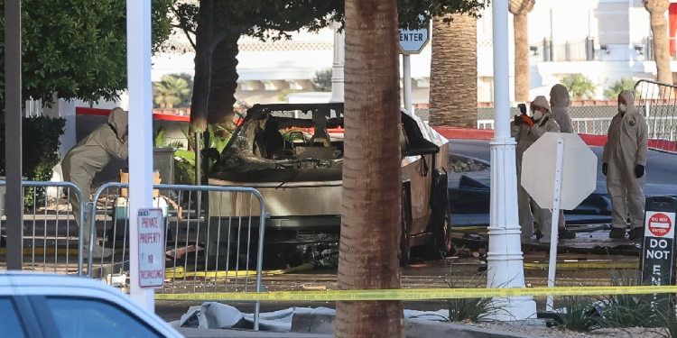 Investigators photograph a Tesla Cybertruck that exploded outside the lobby of President-elect Donald Trump's hotel in Las Vegas / ©AFP