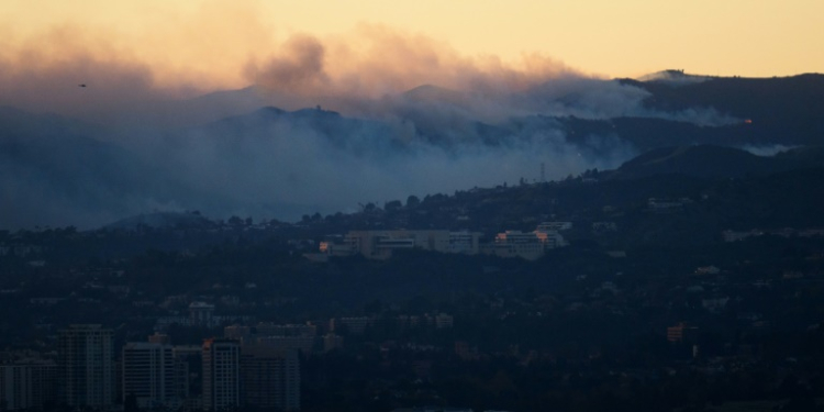 Flames and smoke behind the Getty Center museum on January 8, 2025. ©AFP