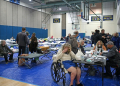 Evacuees from the Palisades Fire are seen at a shelter where donations have been pouring in . ©AFP