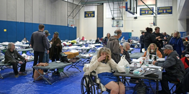 Evacuees from the Palisades Fire are seen at a shelter where donations have been pouring in . ©AFP