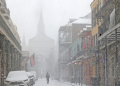 A cathedral in the French Quarter of New Orleans is barely visible in heavy snow that has blanketed the southern US city in a rare winter storm. ©AFP