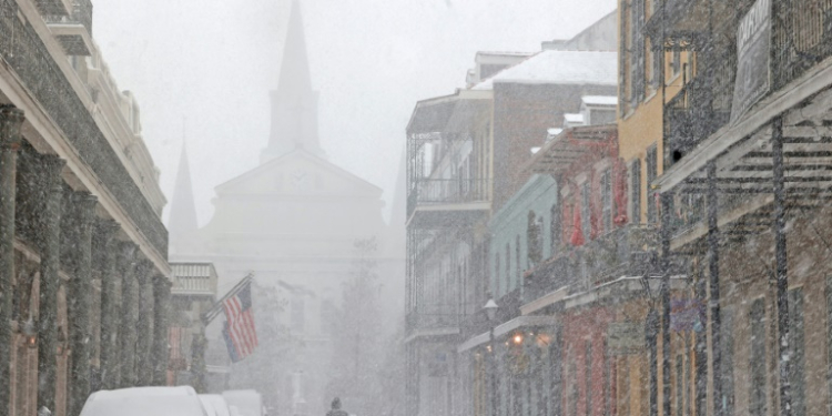 A cathedral in the French Quarter of New Orleans is barely visible in heavy snow that has blanketed the southern US city in a rare winter storm. ©AFP