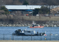 A police boat gathers wreckage along the Potomac River after American Airlines flight 5342 collided with a US Army helicopter. ©AFP